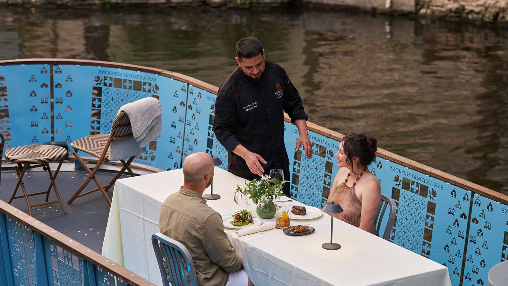 Couple being served on river cruise