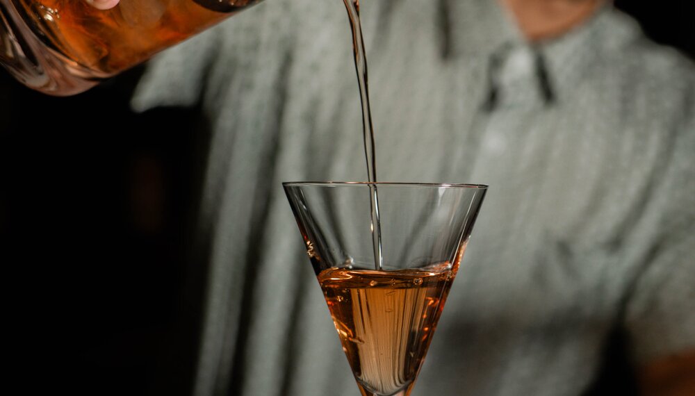 Bartender pouring cocktail